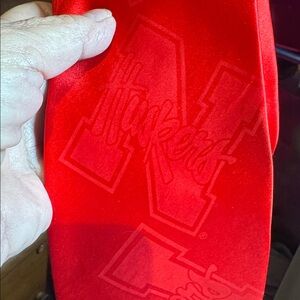 Red Silk Necktie with Subtle Nebraska Huskers Tone on Tone Pattern.